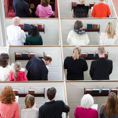people at worship in pews