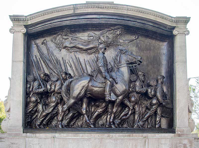 Man sitting on horse and his soldiers walking