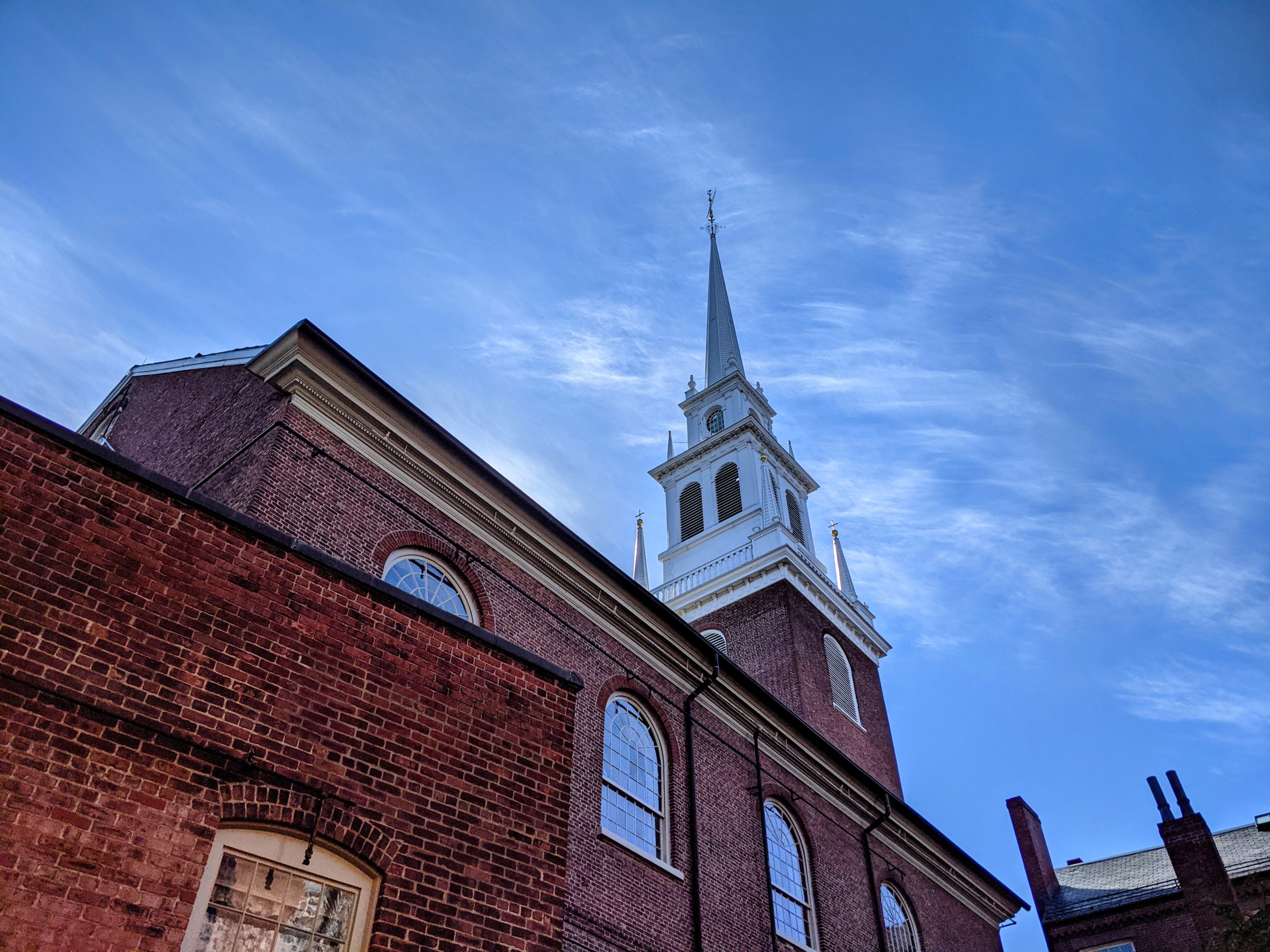 Old North's steeple against a blue sky.