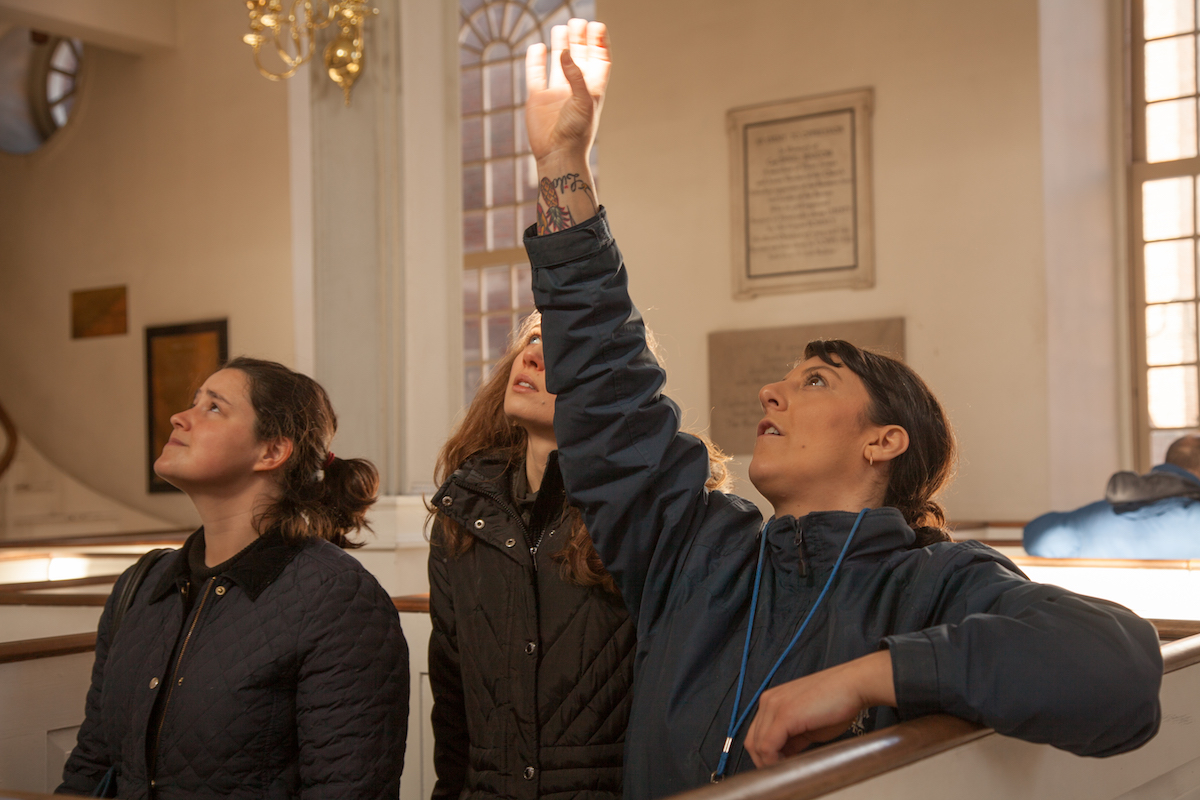 Educator leading a tour in Old North Church.